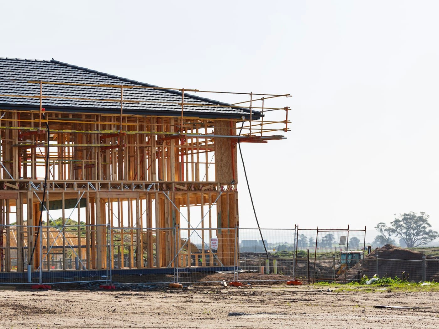 A residence under construction with scaffolding in place (stock photograph, not a Craft Homes project)